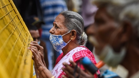 Devotees pay obeisance outside Lord Vithal-Rukmini Temple on the occasion of Ashadi Ekadashi as temples are still closed following Covid-19 protocols, at Dadar in Mumbai, Tuesday, July 20, 2021. (PTI)