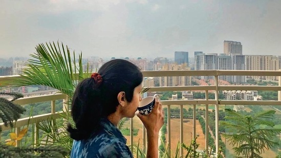 Divya Babu is enjoying this magical sight perched far above the wet earth mired in flooded underpasses and traffic jams—on the balcony of her 30th floor apartment in Gurugram’s Sector 54.(Mayank Austen Soofi)