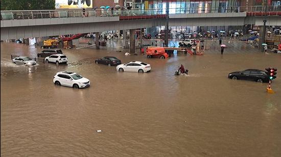 A flooded street following heavy rains in Zhengzhou in China’s central Henan province. (AFP)