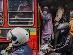 Commuters wearing masks travel on a bus in Mumbai, on July 13. Maharashtra reconciled 3,509 Covid-19 fatalities on July 20, which resulted in a sharp and unexpected jump in the number of India's daily Covid-19 toll which, for the past few days, has been on a steady decline, HT reported.