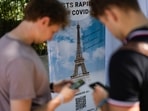 Visitors register for Covid-19 tests at the Eiffel Tower in Paris on Wednesday, July 21, 2021. (Danie Cole / AP) Visitors register for Covid-19 tests at the Eiffel Tower in Paris on Wednesday, July 21, 2021. (Danie Cole / AP)
