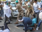 Supporters of Uttar Pradesh Congress chief, Ajay Kumar Lallu, try to block the way after the former was arrested by a team of Lucknow police.(PTI Photo)