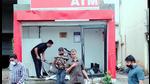 Police probe staff examine the spot for clues after robbers blow up an ATM near Chakan Vasuli phata road, on Wednesday. A group of men blow up an ATM centre in Pune using explosive and steal <span class='webrupee'>₹</span>28 lakh, according to the bank officials (HT) Police probe staff examine the spot for clues after robbers blow up an ATM near Chakan Vasuli phata road, on Wednesday. A group of men blow up an ATM centre in Pune using explosive and steal <span class='webrupee'>₹</span>28 lakh, according to the bank officials (HT)