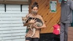 Shibani Dandekar carrying a dog in her arms. Shibani Dandekar carrying a dog in her arms.