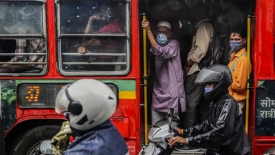 Commuters wearing masks travel on a bus in Mumbai, on July 13. Maharashtra reconciled 3,509 Covid-19 fatalities on July 20, which resulted in a sharp and unexpected jump in the number of India's daily Covid-19 toll which, for the past few days, has been on a steady decline, HT reported. (Rafiq Maqbool / AP) Commuters wearing masks travel on a bus in Mumbai, on July 13. Maharashtra reconciled 3,509 Covid-19 fatalities on July 20, which resulted in a sharp and unexpected jump in the number of India's daily Covid-19 toll which, for the past few days, has been on a steady decline, HT reported. (Rafiq Maqbool / AP)