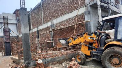 An illegal structure being razed near Kailash Chowk in Ludhiana on Thursday. (HT PHOTO)