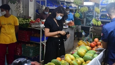 Rhea Chakraborty goes vegetable shopping. 