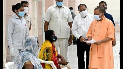 UP chief minister Yogi Adityanath listens to the grievances of people during the ‘Janata Darshan’ programme, at his official residence, in Lucknow recently (ANI Photo)