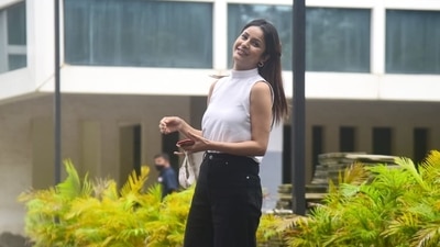Shehnaaz Gill takes her mask off for photos. 