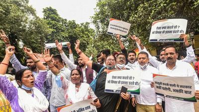 Congress workers staging a protest in Lucknow on Thursday. (PTI PHOTO)
