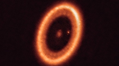 This image shows the PDS 70 system, located nearly 400 light-years away and still in the process of being formed. (Photo by Handout / European Southern Observatory / AFP) This image shows the PDS 70 system, located nearly 400 light-years away and still in the process of being formed. (Photo by Handout / European Southern Observatory / AFP)