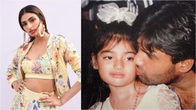 Athiya Shetty: Sunil Shetty's daughter Athiya often shares unseen pictures from her childhood on her Instagram handle. In this adorable still from her young days, daddy Sunil showers all his love on his little one. (Instagram/@athiyashetty)