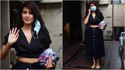 Rhea wore a short-sleeve black crop top for the outing. It came with a cinched hem and an overlapping, plunging V neckline. (Varinder Chawla) Rhea wore a short-sleeve black crop top for the outing. It came with a cinched hem and an overlapping, plunging V neckline. (Varinder Chawla)