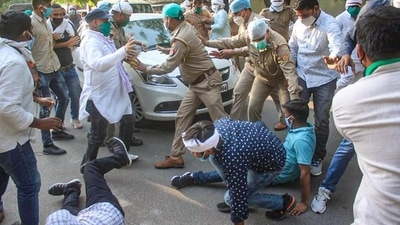 Supporters of Uttar Pradesh Congress chief, Ajay Kumar Lallu, try to block the way after the former was arrested by a team of Lucknow police. (PTI Photo) Supporters of Uttar Pradesh Congress chief, Ajay Kumar Lallu, try to block the way after the former was arrested by a team of Lucknow police. (PTI Photo)