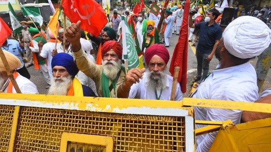 Farmers shout slogans near India's Parliament to mark eight months of their agitation against new agricultural laws that they say will devastate their income.(Raj K Raj/HT Photo)