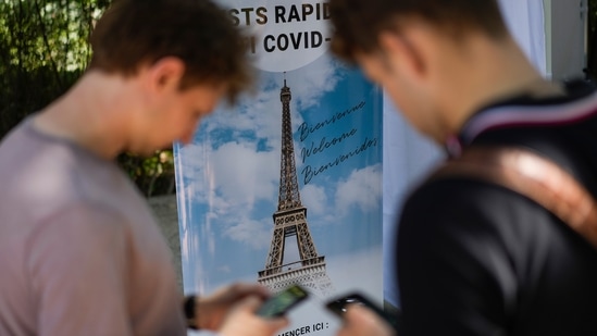 Visitors register for Covid-19 tests at the Eiffel Tower in Paris on Wednesday, July 21, 2021. (Danie Cole / AP)