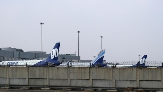 Grounded aircraft stand at Terminal 2 at the Indira Gandhi International Airport in New Delhi.(Bloomberg file photo)