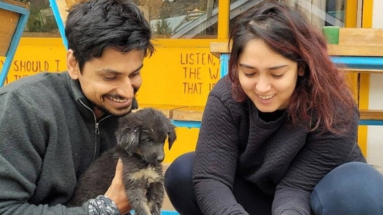 Nupur Shikhare and Ira Khan petting some puppies.