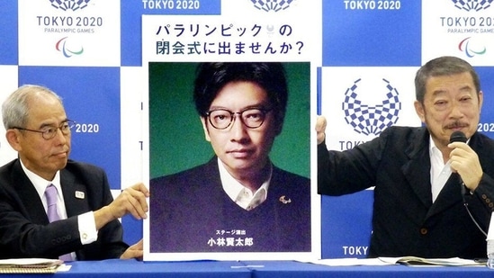 A photo of Kentaro Kobayashi is held up by Tokyo 2020 organisers. (Getty Images)