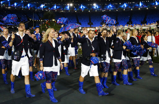FILE - Athletes from Czech Republic parade during the Opening Ceremony at the Summer Olympics on July 27, 2012, in London. Olympic gear makes for lively social media fodder, starting with the hours-long Parade of Nations. The year's wait due to the pandemic has given enthusiasts extra time to ponder what they love or hate. Shown are the country's loud umbrellas and neon blue Wellington boots.(AP) FILE - Athletes from Czech Republic parade during the Opening Ceremony at the Summer Olympics on July 27, 2012, in London. Olympic gear makes for lively social media fodder, starting with the hours-long Parade of Nations. The year's wait due to the pandemic has given enthusiasts extra time to ponder what they love or hate. Shown are the country's loud umbrellas and neon blue Wellington boots.(AP)
