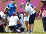 Svetlana Gomboeva (ROC) is treated for heat exhaustion after completion of the archery ranking round during the Tokyo 2020 Olympic Summer Games.
