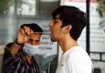 A health worker tests a person for Covid-19 at Govt Poly Clinic Sector 31, in Gurugram. (Vipin Kumar/ Hindustan Times) A health worker tests a person for Covid-19 at Govt Poly Clinic Sector 31, in Gurugram. (Vipin Kumar/ Hindustan Times)