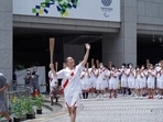Kankuro Nakamura, a kabuki actor and the final torchbearer for the Tokyo Olympics, waves during the final torch relay event at the Tokyo Metropolitan Government complex in Tokyo Friday, July 23, 2021.(AP) Kankuro Nakamura, a kabuki actor and the final torchbearer for the Tokyo Olympics, waves during the final torch relay event at the Tokyo Metropolitan Government complex in Tokyo Friday, July 23, 2021.(AP)