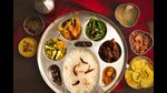 A typical Rana meal, served in silver thaal, includes two types of dal, vegetables, mutton korma, chara ko ras (chicken soup), a yogurt-based salad, pickles and rice. A typical Rana meal, served in silver thaal, includes two types of dal, vegetables, mutton korma, chara ko ras (chicken soup), a yogurt-based salad, pickles and rice.