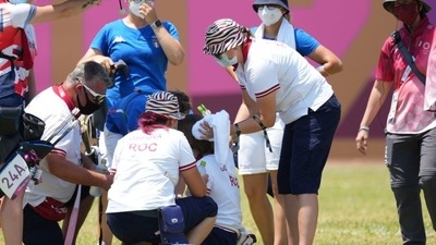 Svetlana Gomboeva (ROC) is treated for heat exhaustion after completion of the archery ranking round during the Tokyo 2020 Olympic Summer Games. (USA TODAY Sports)