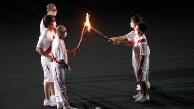 The Tokyo 2020 Olympics opening ceremony: The Olympic flame entered the stadium as last and was passed on through generations. (AFP) The Tokyo 2020 Olympics opening ceremony: The Olympic flame entered the stadium as last and was passed on through generations. (AFP)