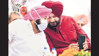 Newly appointed Punjab Congress president Navjot Singh Sidhu interacts with Punjab chief minister Captain Amarinder Singh at Punjab Bhawan in Chandigarh on Friday. (ANI) Newly appointed Punjab Congress president Navjot Singh Sidhu interacts with Punjab chief minister Captain Amarinder Singh at Punjab Bhawan in Chandigarh on Friday. (ANI)