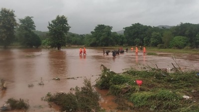 National Disaster Response Force (NDRF) shows NDRF personnel rescuing stranded villagers from low lying areas flooded after heavy monsoon rains in Chiplun district of Maharashtra. (AFP) National Disaster Response Force (NDRF) shows NDRF personnel rescuing stranded villagers from low lying areas flooded after heavy monsoon rains in Chiplun district of Maharashtra. (AFP)
