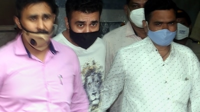 Raj Kundra (Centre) being taken to the Esplanade Court on Friday where his police custody was extended until July 27. (PTI) Raj Kundra (Centre) being taken to the Esplanade Court on Friday where his police custody was extended until July 27. (PTI)