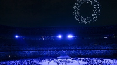 The Tokyo 2020 Olympics opening ceremony: Drone form the Olympic emblem in the night sky after the Olympic Oath was taken, (TWITTER) The Tokyo 2020 Olympics opening ceremony: Drone form the Olympic emblem in the night sky after the Olympic Oath was taken, (TWITTER)