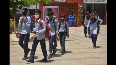 Students head home after classes at Government Senior Secondary School, Sector 45, in Chandigarh on Friday. The city’s government schools had resumed physical classes on July 19. (Keshav Singh/HT) Students head home after classes at Government Senior Secondary School, Sector 45, in Chandigarh on Friday. The city’s government schools had resumed physical classes on July 19. (Keshav Singh/HT)