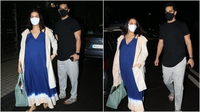 Neha carried a turquoise blue shoulder bag with her attire. She teamed her look with a white face mask, middle-parted open locks, and no accessories. Her pregnancy glow took things up a notch. (Varinder Chawla) Neha carried a turquoise blue shoulder bag with her attire. She teamed her look with a white face mask, middle-parted open locks, and no accessories. Her pregnancy glow took things up a notch. (Varinder Chawla)