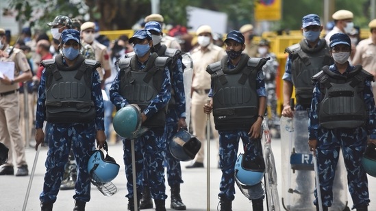 New Delhi, India - July 22, 2021: Police and Rapid Action Forces (RAF) personnel stand guard at Jantar Mantar during a protest by farmers against the new farm laws, in New Delhi, India, on Thursday, July 22, 2021. (Photo by Raj K Raj / Hindustan Times)(Raj K Raj/HT Photo) New Delhi, India - July 22, 2021: Police and Rapid Action Forces (RAF) personnel stand guard at Jantar Mantar during a protest by farmers against the new farm laws, in New Delhi, India, on Thursday, July 22, 2021. (Photo by Raj K Raj / Hindustan Times)(Raj K Raj/HT Photo)