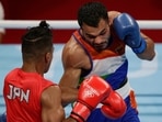Tokyo 2020 Olympics: Men's Welterweight - Last 32 - Kokugikan Arena - Tokyo, Japan - July 24, 2021. Sewonrets Quincy Mensah Okazawa of Japan in action against Vikas Krishan of India
