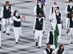 Pakistan's flag bearer Mahoor Shahzad and Pakistan's flag bearer Muhammad Khalil Akhtar lead the delegation during the opening ceremony of the Tokyo 2020 Olympic Games, at the Olympic Stadium, in Tokyo,
