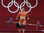 Mirabai Chanu reacts after a successful attempt in the 49 kg category of Women's Weightlifting event of the Summer Olympics 2020, in Tokyo. 