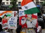 Students celebrate weightlifter Mirabai Chanu's silver medal win at the Tokyo Games, in Mumbai, Saturday, July 24, 2021.