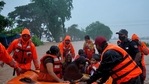 Rescue workers evacuate people from a flooded area to safer places after heavy rains in Kolhapur. (REUTERS) Rescue workers evacuate people from a flooded area to safer places after heavy rains in Kolhapur. (REUTERS)