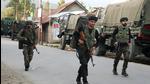 Indian security forces personnel during an encounter with militants in Warpora area of Sopore in north Kashmir’s Baramulla district on Friday. (PTI) Indian security forces personnel during an encounter with militants in Warpora area of Sopore in north Kashmir’s Baramulla district on Friday. (PTI)