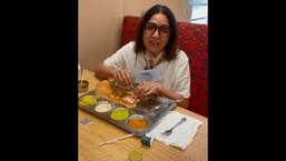 The image shows Neena Gupta enjoying dosa.