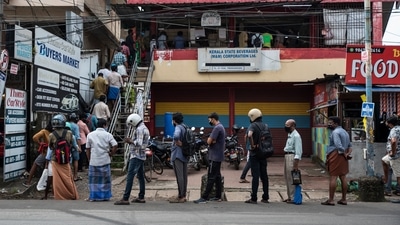 FILE PHOTO: People wearing masks as a precaution against the coronavirus disease (Covid-19) queue up maintaining physical distance to buy liquor in Kochi, Kerala, on Friday, July 23, 2021. (R S Iyer / AP) FILE PHOTO: People wearing masks as a precaution against the coronavirus disease (Covid-19) queue up maintaining physical distance to buy liquor in Kochi, Kerala, on Friday, July 23, 2021. (R S Iyer / AP)