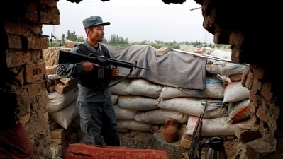 An Afghan policeman keeps watch at a checkpost on the outskirts of Kabul, Afghanistan. (Reuters File Photo)