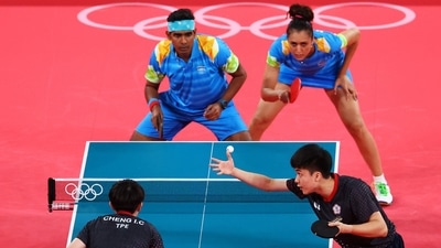Tokyo 2020 Olympics - Table Tennis - Mixed Doubles - Last 16 - Tokyo Metropolitan Gymnasium - Tokyo, Japan - July 24, 2021.   Sharath Achanta of India and Manika Batra of India in action against Lin Yun-Ju of Taiwan and Cheng I-Ching of Taiwan REUTERS/Thomas Peter (REUTERS)