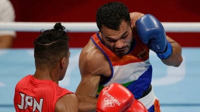 Tokyo 2020 Olympics: Men's Welterweight - Last 32 - Kokugikan Arena - Tokyo, Japan - July 24, 2021. Sewonrets Quincy Mensah Okazawa of Japan in action against Vikas Krishan of India (REUTERS)