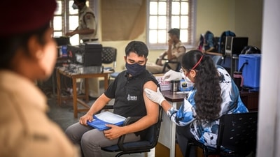 A health worker administers a shot of Covid vaccine to a beneficiary at Mandir Marg in New Delhi, India, on Wednesday, July 21, 2021. (Photo by Sanchit Khanna/ Hindustan Times)