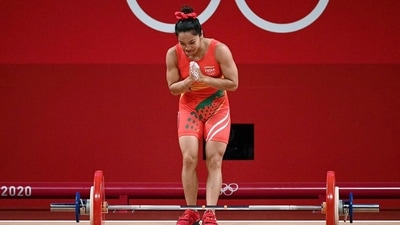 Weightlifter Mirabai Chanu during the Women's 49kg category weightlifting attempt as she wins a silver medal at Tokyo Olympics 2020, in Tokyo on Saturday. (ANI Photo)